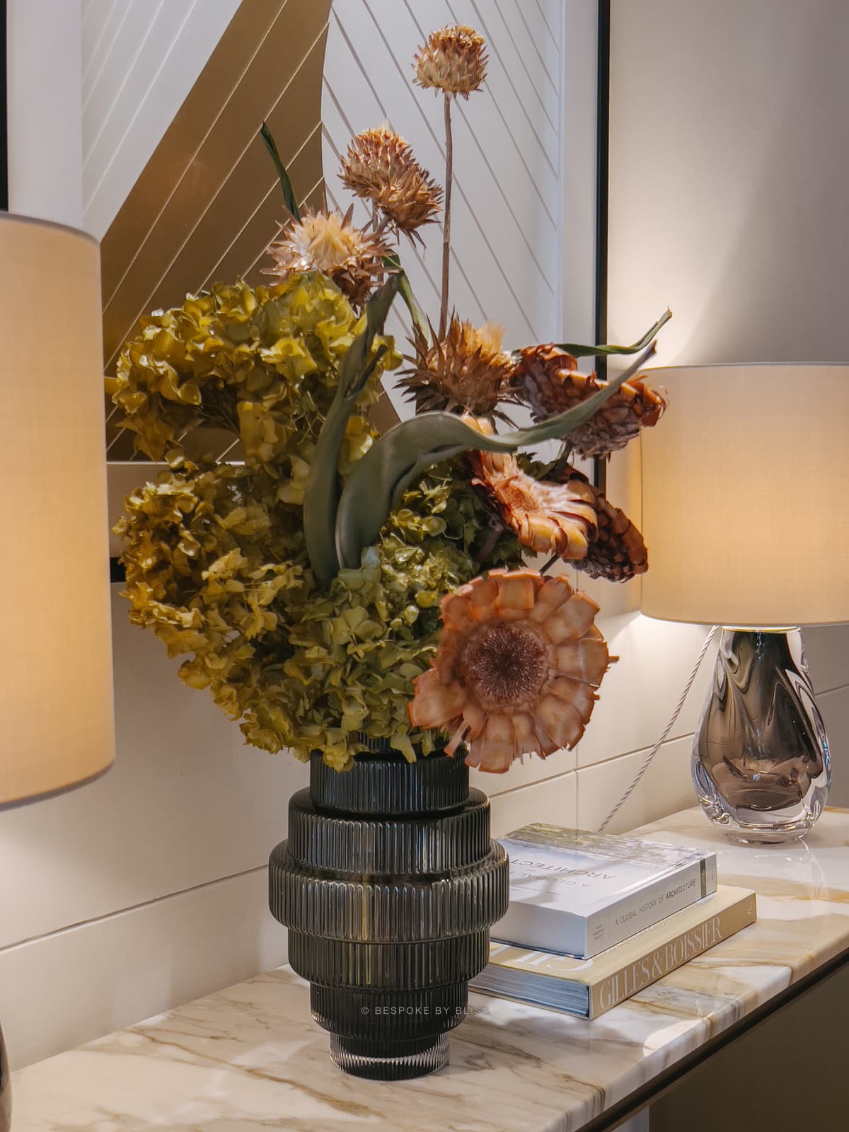 Statement floral arrangement in olive, rust and gold