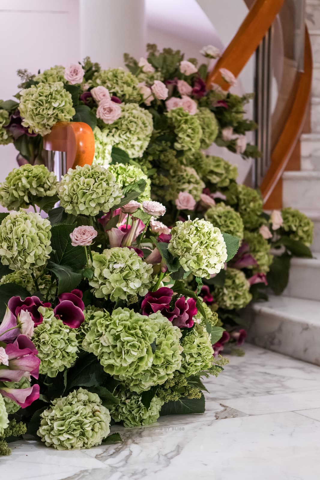 Statement floral arrangement in green, pink and burgundy