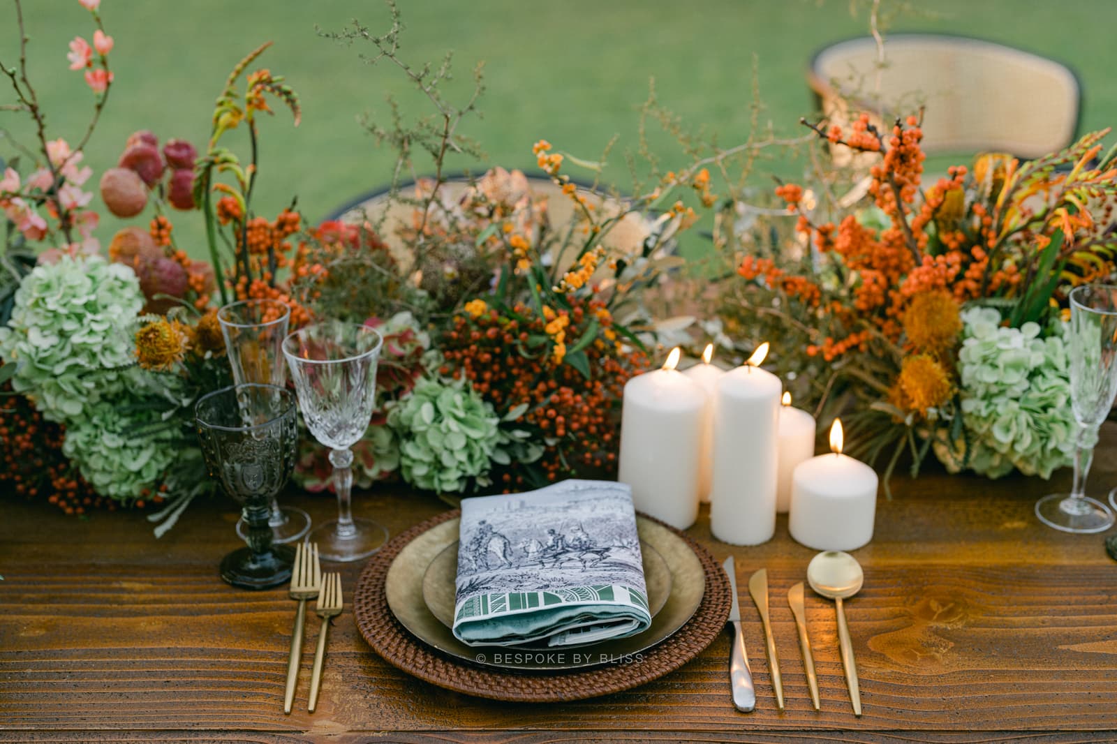 Table centrepiece in orange, green and ivory