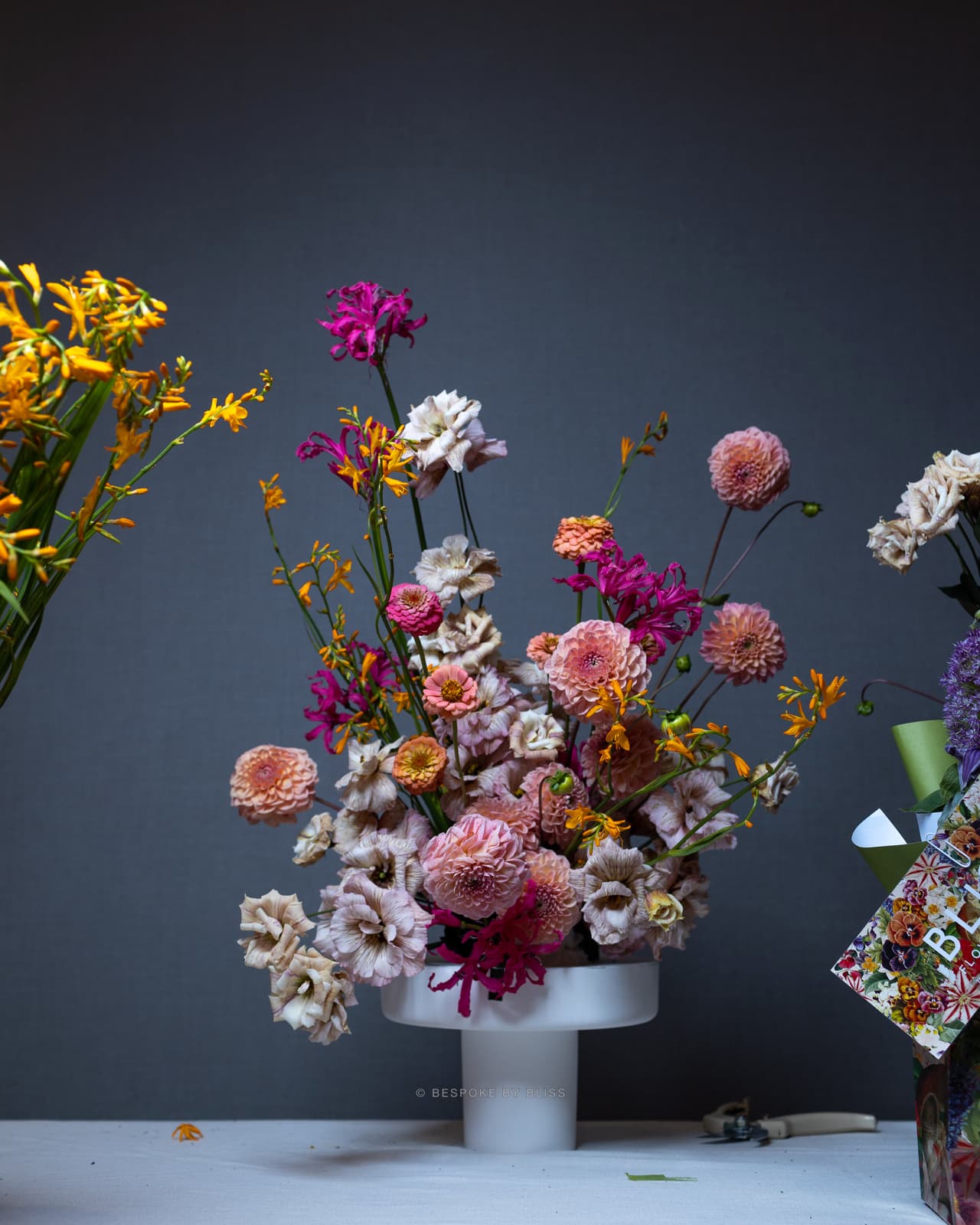Statement floral arrangement in dusty pink, mauve and orange