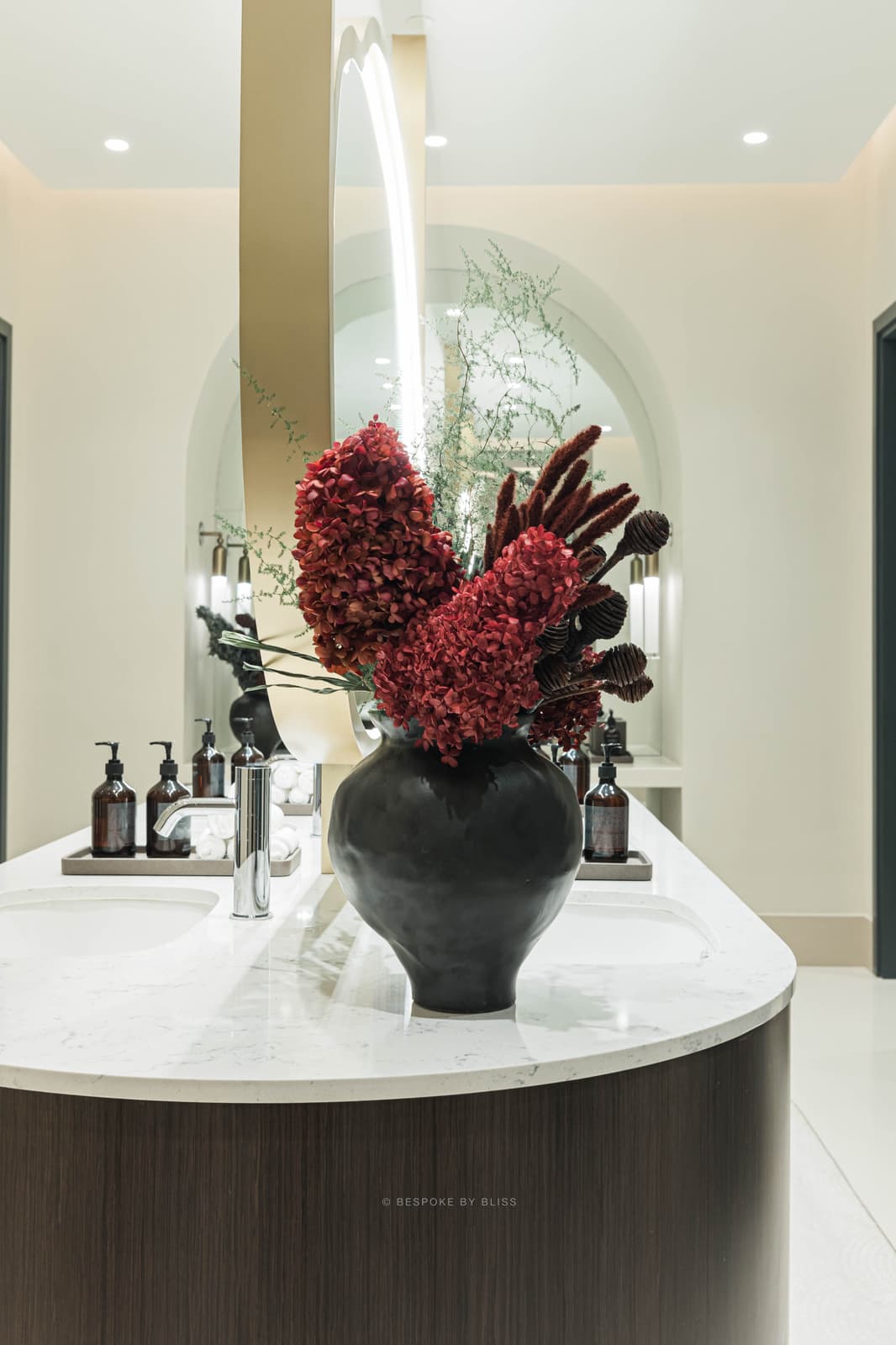 Statement floral arrangement in burgundy, black and cream