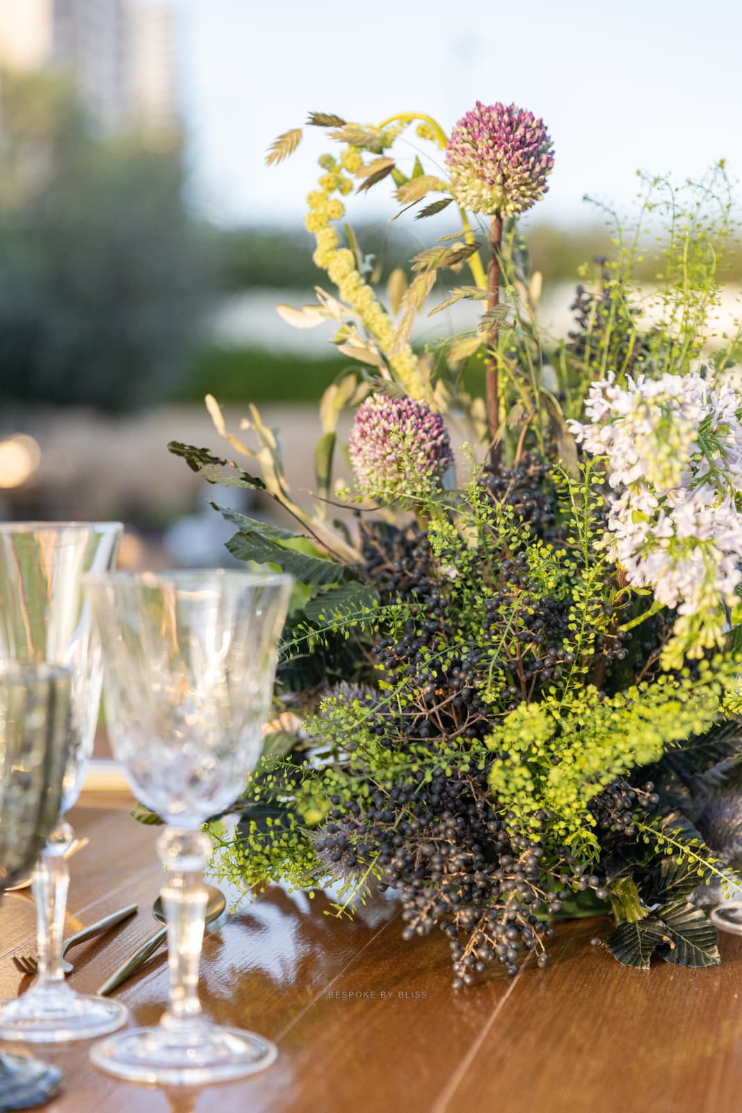 Table centrepiece in green, purple and lilac