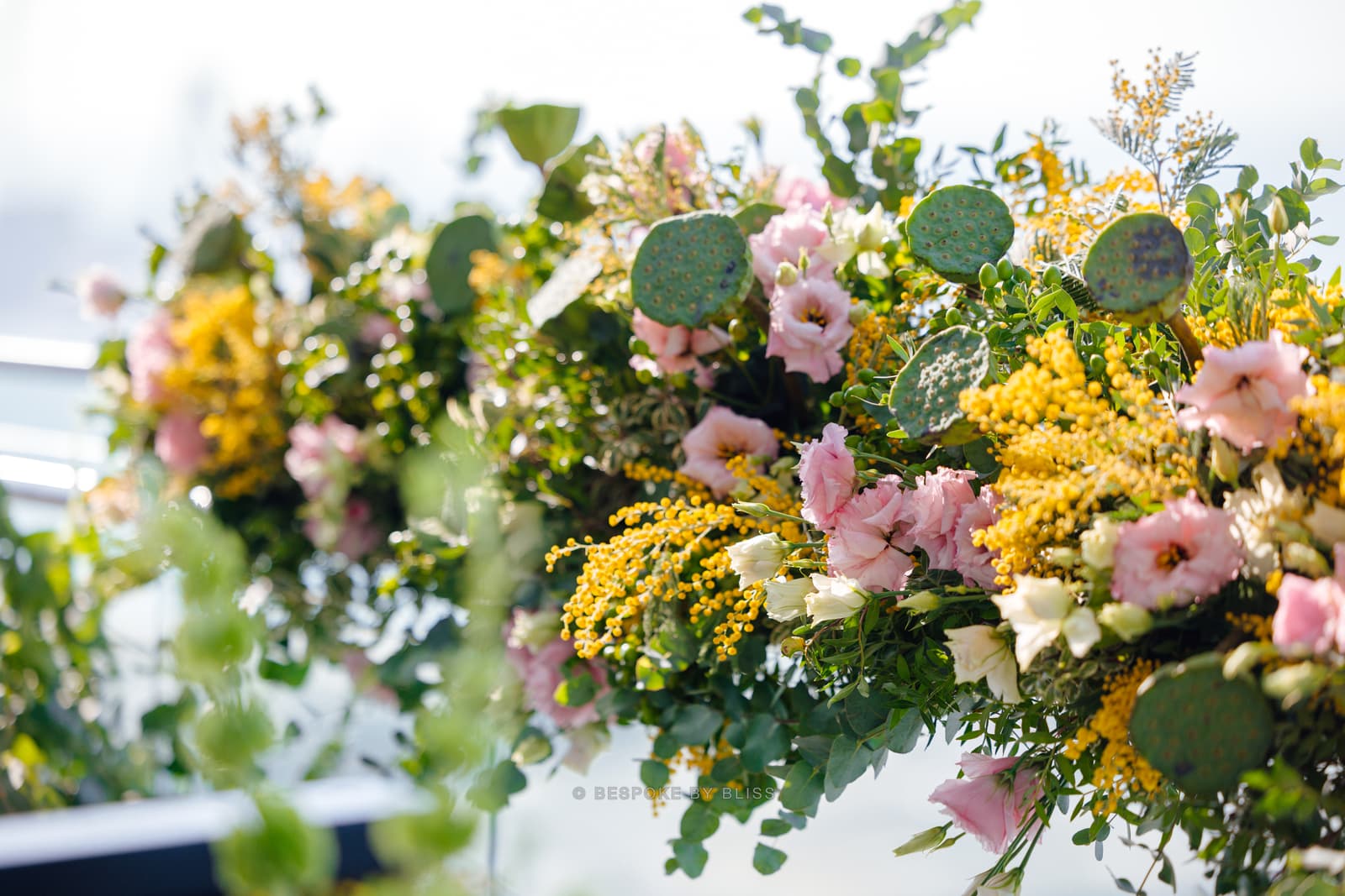 Floral wall or arch in yellow, pink and green