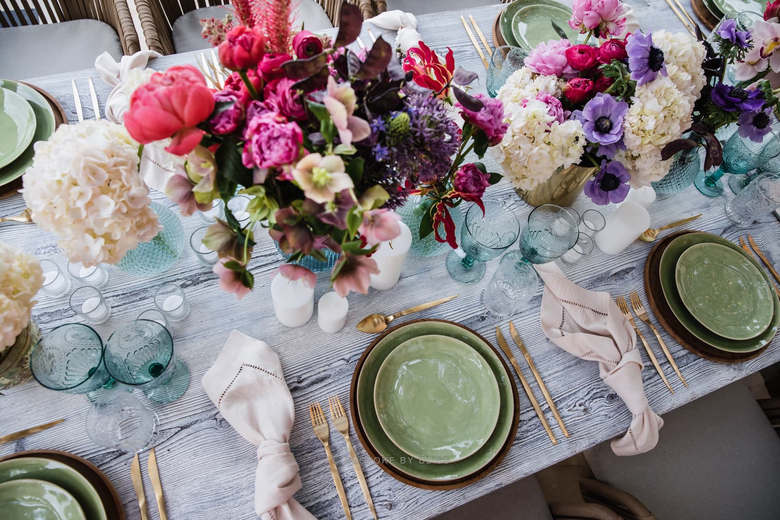 Table centrepiece in sage, fuchsia and purple
