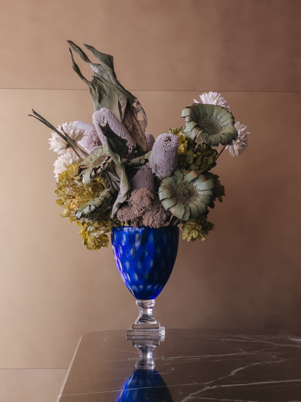 Statement floral arrangement in lilac, cobalt and sage