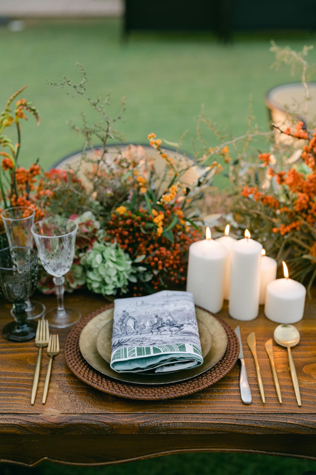 Table setting detail in orange, green and ivory