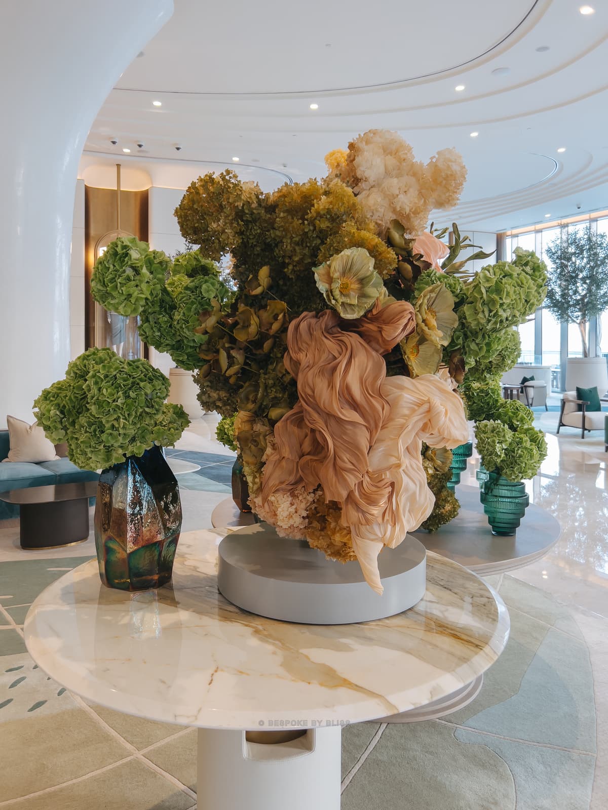 Statement floral arrangement in olive, blush and cream