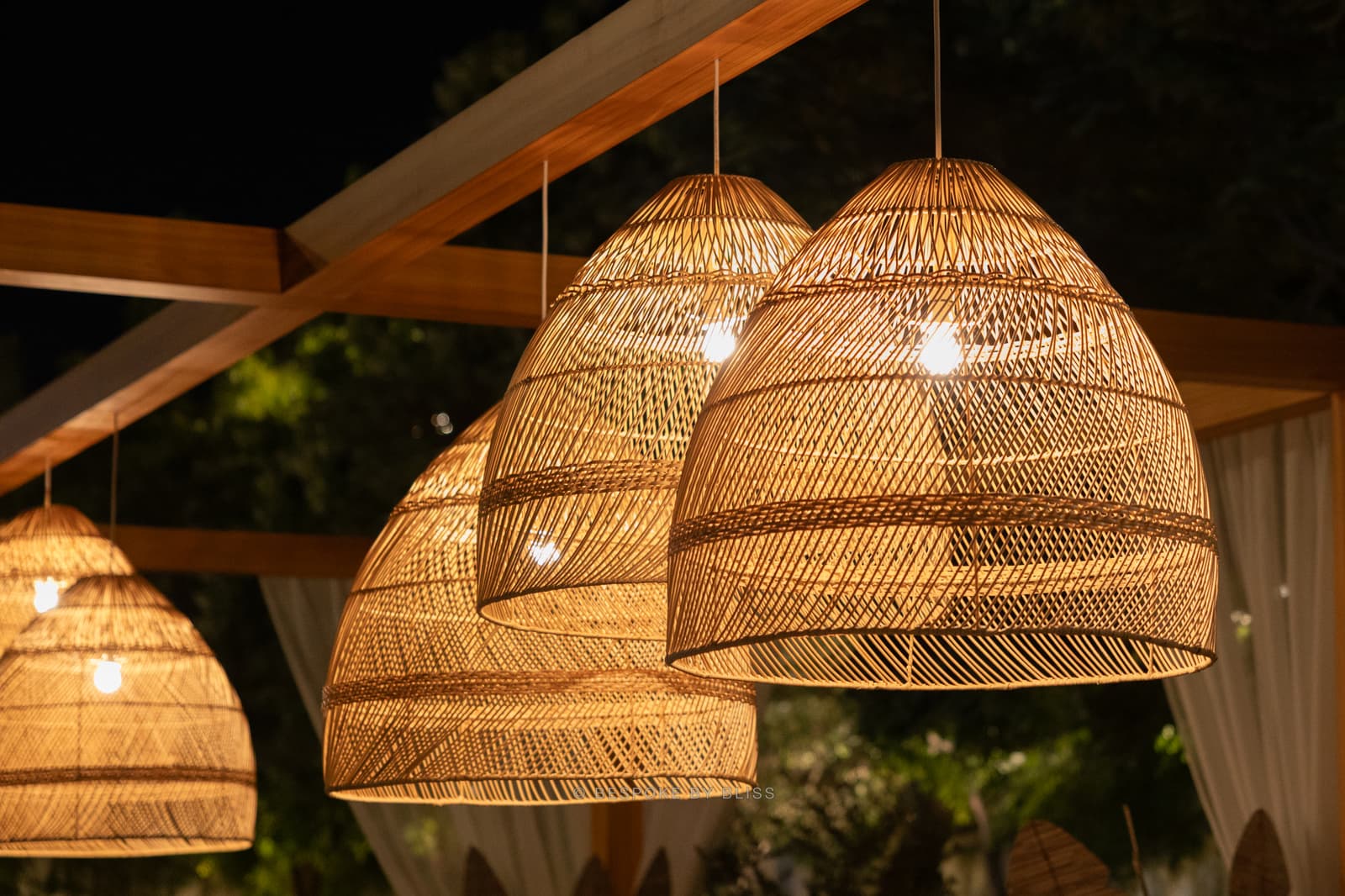 Hanging installation in natural, warm gold and black