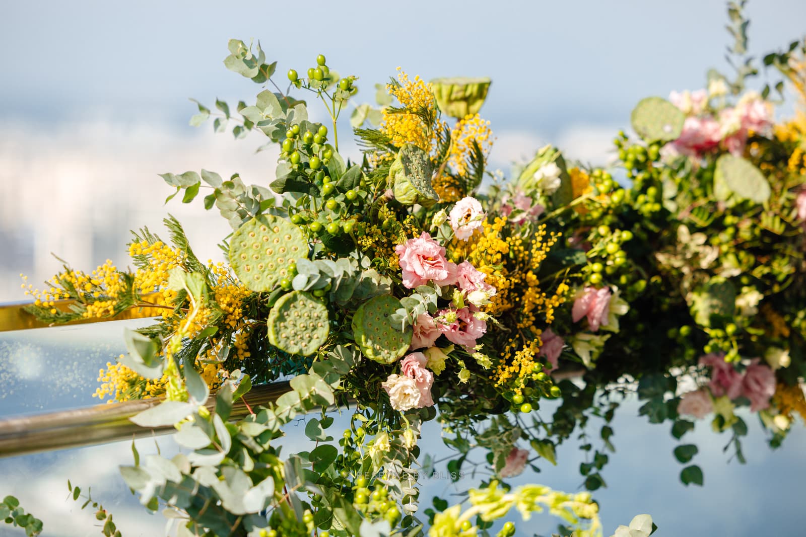 Floral wall or arch in yellow, pink and green