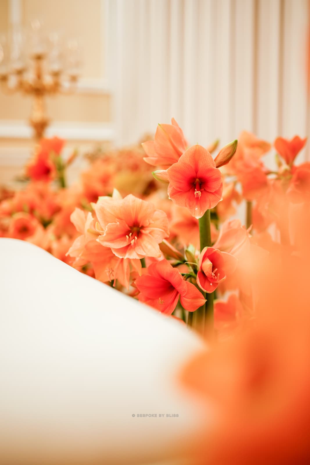Statement floral arrangement in orange, cream and gold
