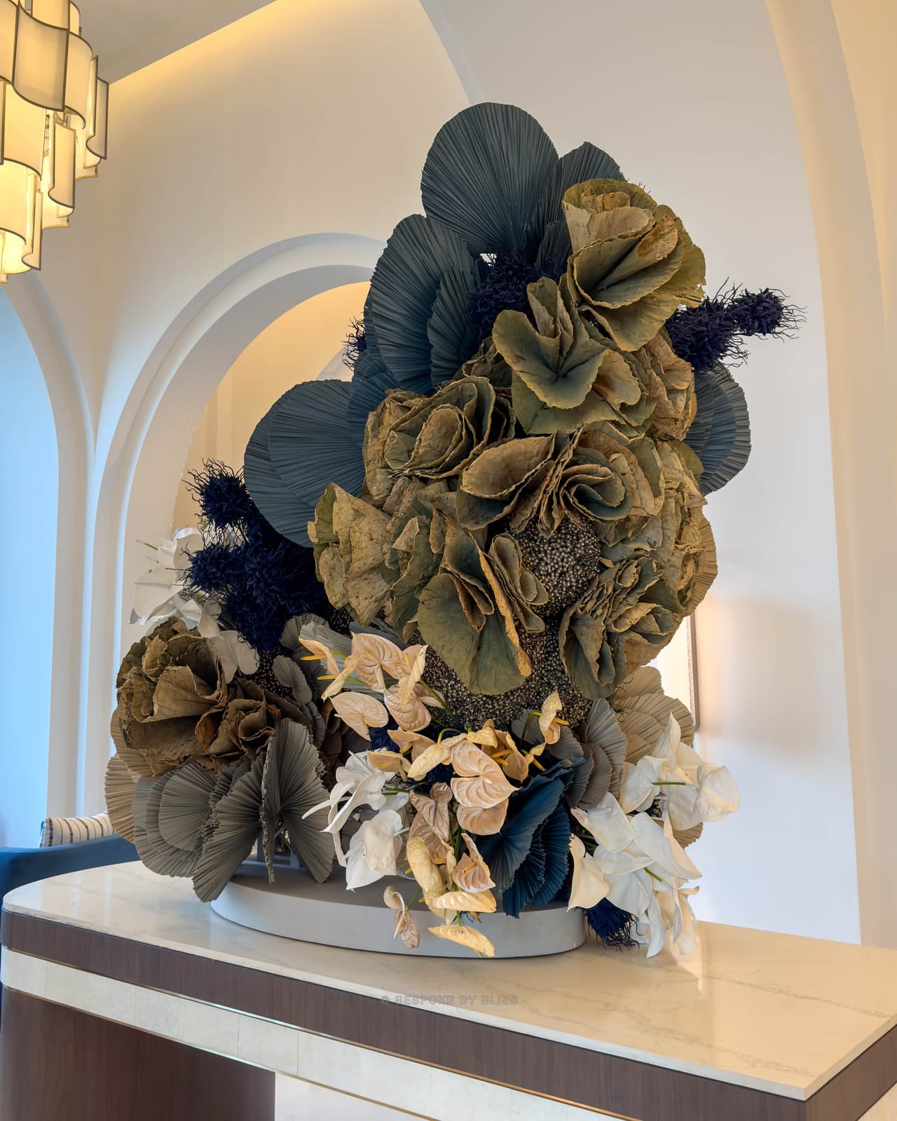 Statement floral arrangement in navy, olive and ivory