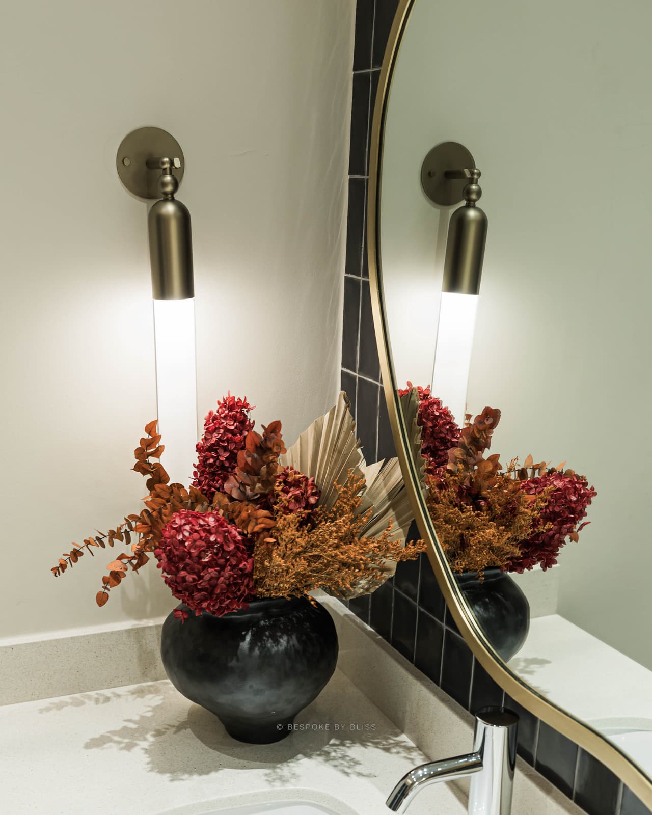 Statement floral arrangement in burgundy, rust and black